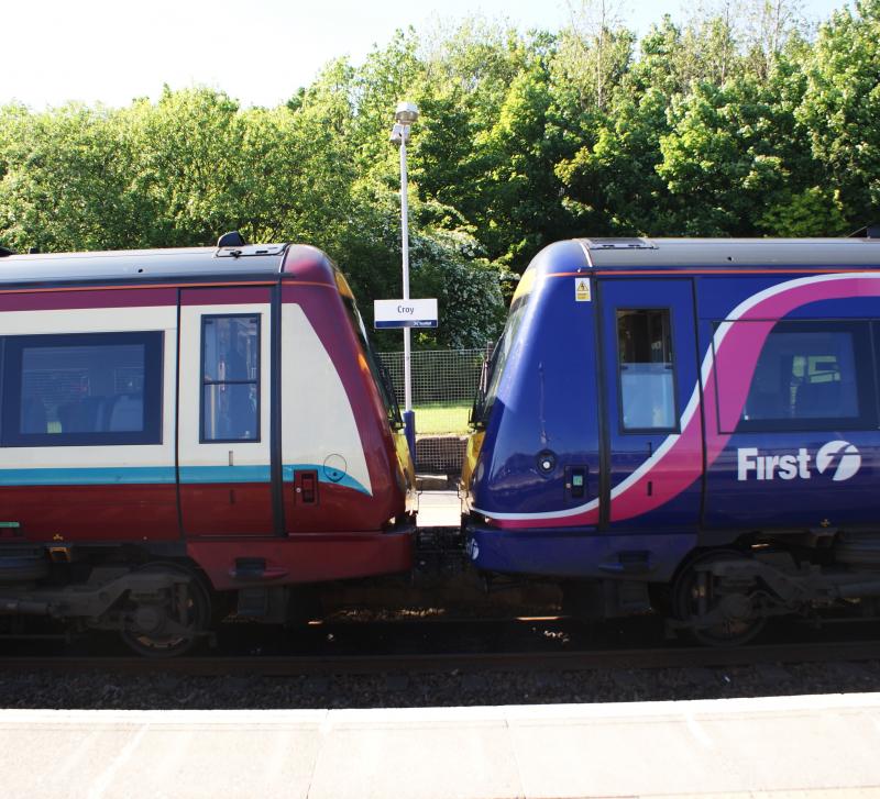 Mixed Liveries: Two 3-car class 170 sets tickled together to make up the longer 6-car train stops at Croy. SPT on the left and Scotrail livery on the right. Photo of Mixed Liveries