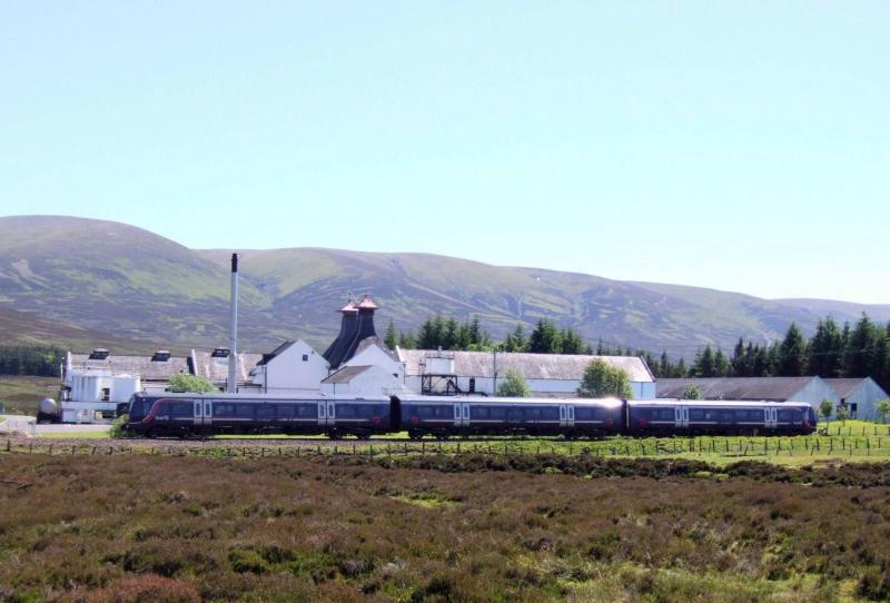 Passing Dalwhinnie Distillery: 12.47 Inverness to Edinburgh Waverley. 23/6/2009 Photo of Passing Dalwhinnie Distillery