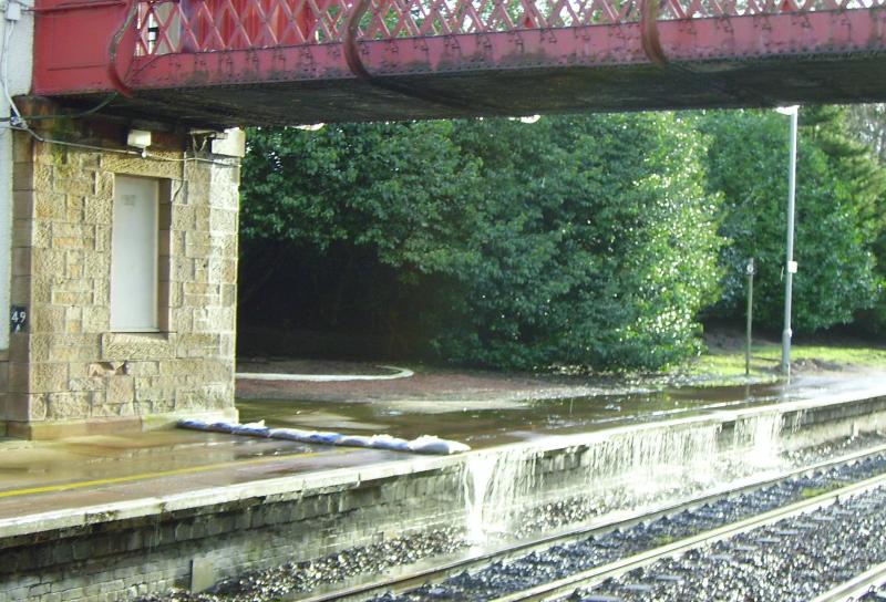 Gleneagles: Water flowing off a field over platform 1 and onto the line at Gleneales - 01/01/07 Photo of Gleneagles
