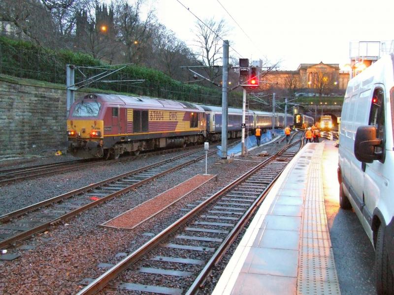 Waverley Derailment: 67004 at the head of 5C11 sleeper empties from Polmadie to Waverley following the derailment of part of the train on the evening of 4 January 2007. Seen here at 0830 the following day. Photo of Waverley Derailment