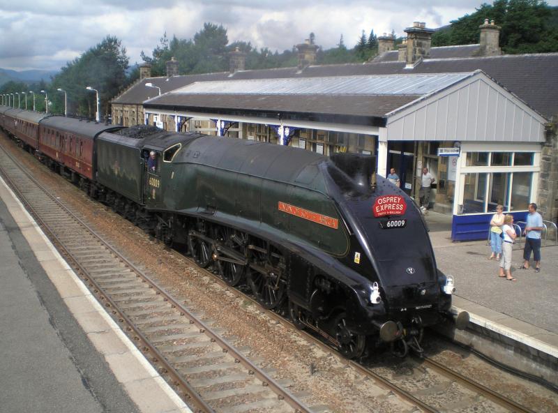 Streaking through Kingussie: No.9 working Perth - Inverness - Perth leg of the Excursion from Polmont. Passing through Kingussie running two minutes early : 4/7/2009 Photo of Streaking through Kingussie