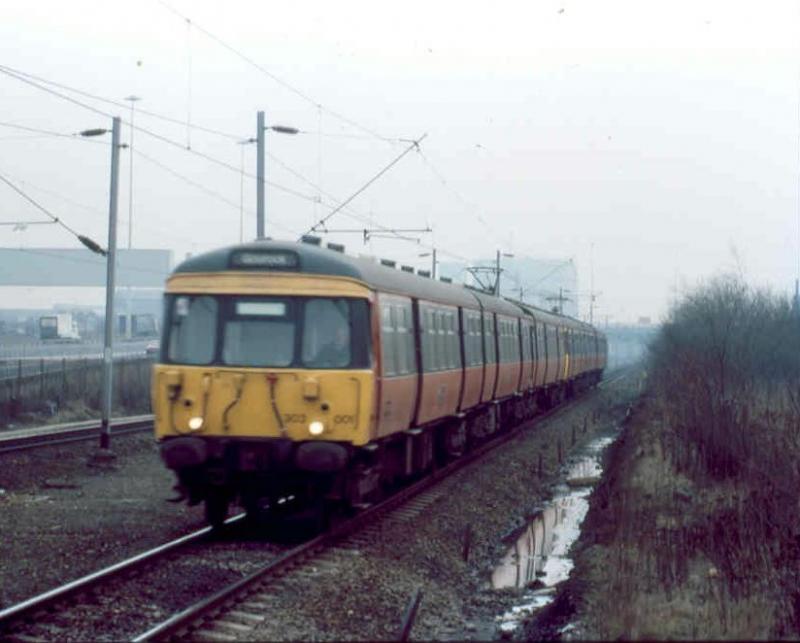 Refurbished glory: 303001 and friend now refurbished, rattle through Cardonald in 1987 with a fast Gourock. Photo of Refurbished glory