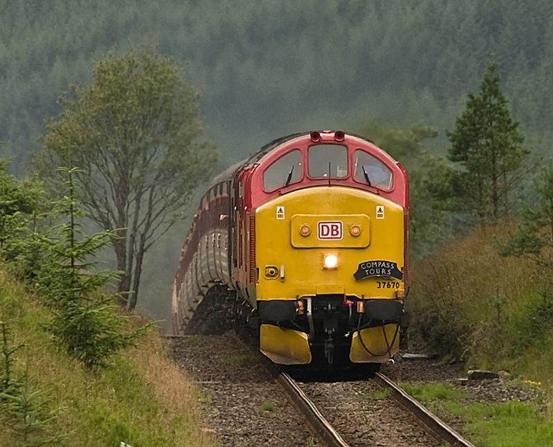 Over the Top: 37670 approaches Tyndrum with Compass Tours' return working from Oban to Workington on 22 August. Photo of Over the Top