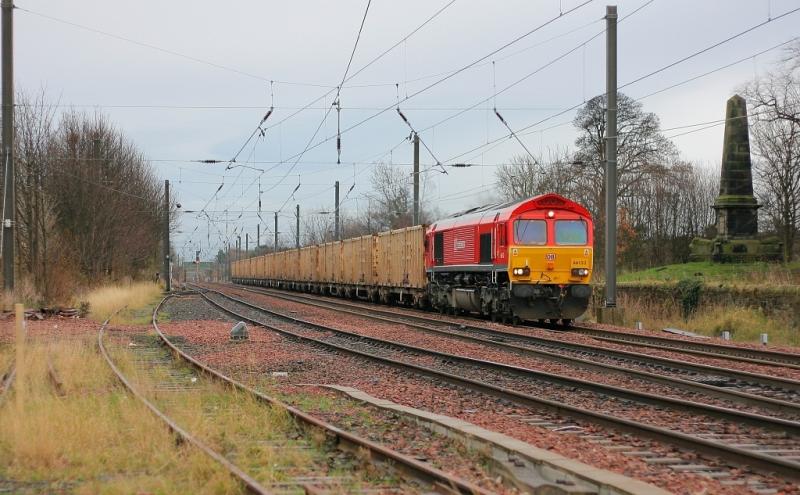 Das Bins: DB Schenker liveried 66152 brightens up an otherwise dull 7th December 2009, as it approaches Prestonpans with the 6B44 Oxwellmains-Powderhall empty binliner. Photo of Das Bins