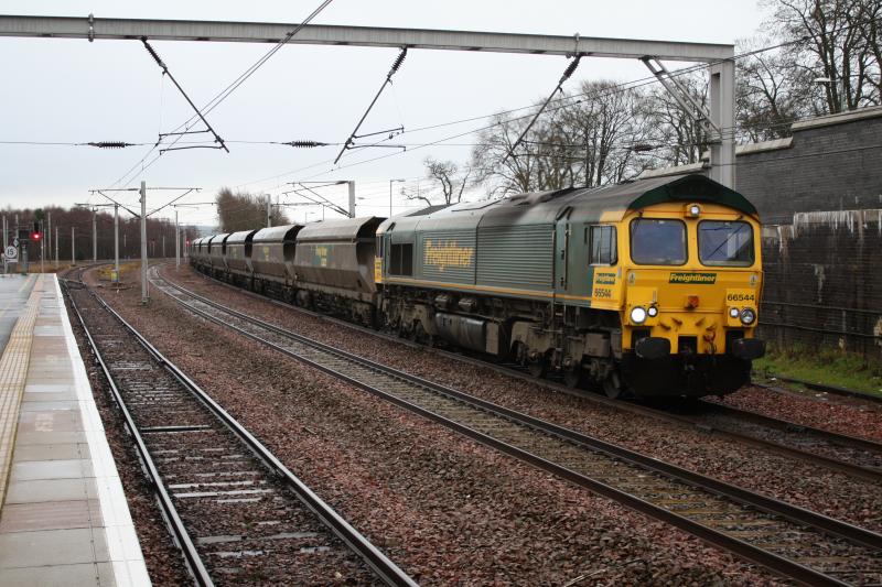 66544: Freightliner 66544 passing carstairs 11.37 empty coal wagons for Ravenstruther.Sorry don't know how to find out which head codes,any help would be gratefully appreciated.DEREKO. Photo of 66544