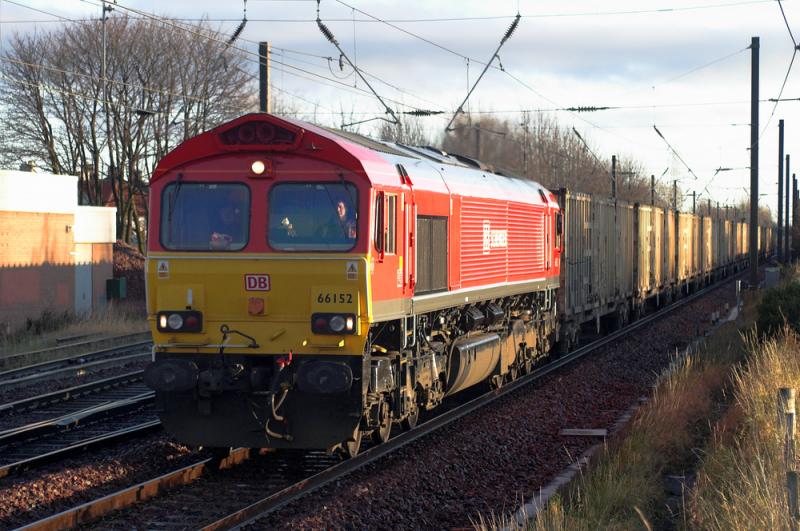 DBS bins in the sun: Positively glowing in the low, winter sun, 66152 approaches Prestonpans with 6B44. 8 December 2009 Photo of DBS bins in the sun