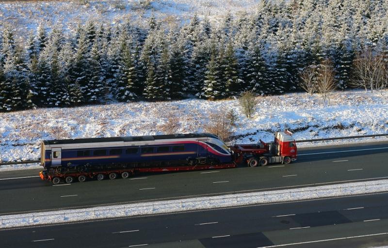 180 on the M74: A 180 driving trailer bound for Glasgow Works is seen on a road trailer on the M74 at Greenhillstairs near Beattock on 22.12.09. Photo of 180 on the M74