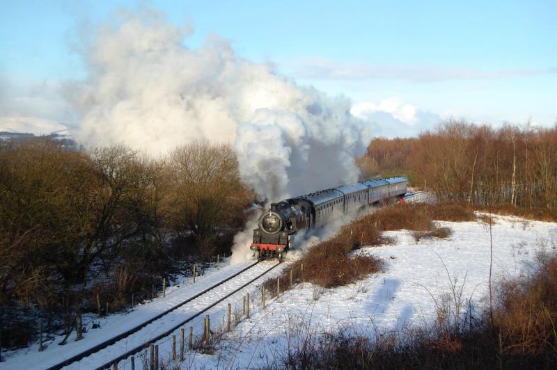 80105 in the sun & snow: Working the final Black Bun special of the season, 4MT 80105 catches some afternoon sunshine as she powers towards Snab Bridge. 2nd January 2010 Photo of 80105 in the sun & snow