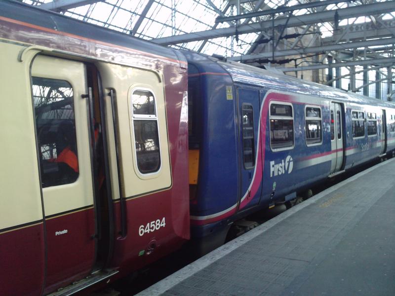 314 + 322 coupled in Glasgow Central: A rather rushed photo of a Class 314 and a Class 322 coupled together in Glasgow Central. They ran in ECS from Shields TMD. Photo of 314 + 322 coupled in Glasgow Central