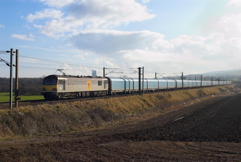 92012 approaching Dunbar: 92012 approaches Dunbar with 4X39 Immingham - Mossend car train. The Oxwellmains cement plant can be seen towards the rear of the loco. 17 February 2010 Photo of 92012 approaching Dunbar