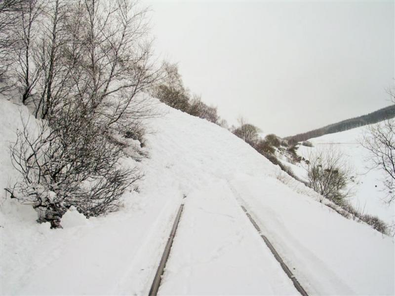 County March Avalanche: The sheer height of this 1st avalanche is clear to see as it greets the snowplough train in the County March area. 26/02/10 Photo courtesy of NR Photo of County March Avalanche