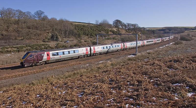Voyager at Grantshouse: Despite the arrival of March, snow continues to lie in small amounts throughout East Berwickhire. A northbound Voyager passes the Oak Bank at Mossfield, Grantshouse on the morning of 1st March. Photo of Voyager at Grantshouse