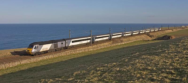 East Coast HST at Lamberton: Having crossed the Border into Scotland on the afternoon of 1st March 2010, an East Coast HST climbs the bank at Lamberton towards Burnmouth, with the North Sea in the background. Photo of East Coast HST at Lamberton