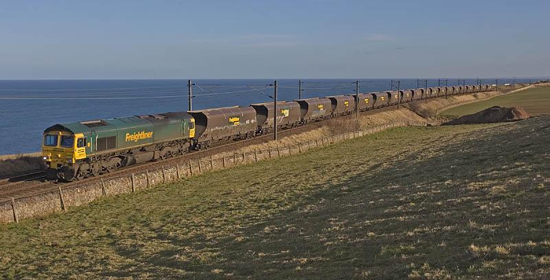 66547 at Lamberton: Shadows begin to lengthen at Lamberton as 66547 attacks the bank up to Burnmouth on the afternoon of 1st March 2010. The locomotive has just crossed the Border into Scotland. Photo of 66547 at Lamberton