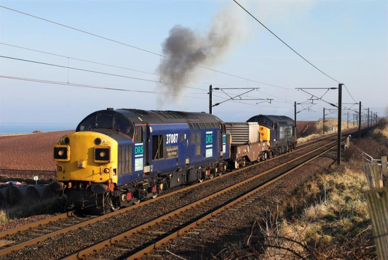 37087 and 37603 with 6M50: 6M50 Torness - Carlisle reverses on the ECML in order to cross over to the down main behind the photographer, just south of Torness. 4 March 2010 Photo of 37087 and 37603 with 6M50
