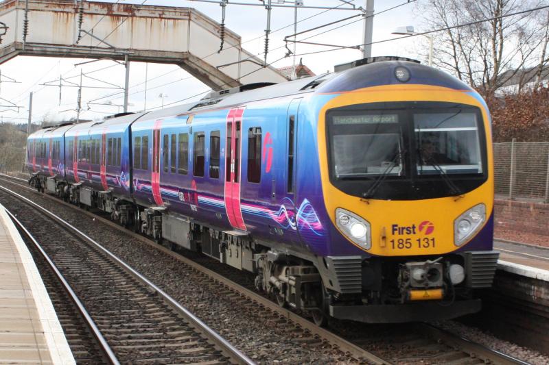 185131: 185131 - Glasgow central - Manchester Airport passing through Carluke @ 15:26 21/3/10. Photo of 185131