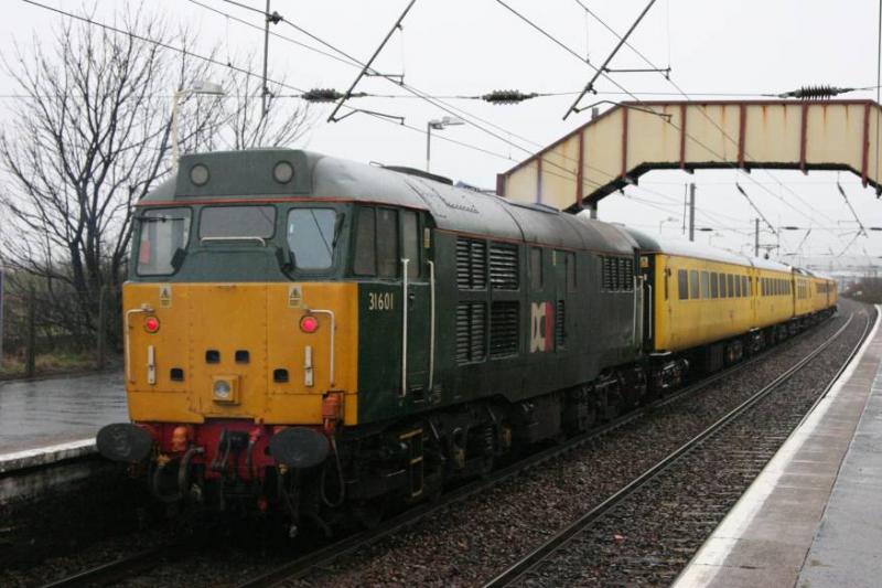 1Q18: 31601 brings up the rear as it passes through Prestwick Town 30/03/10, 31105 is on the front. Photo of 1Q18