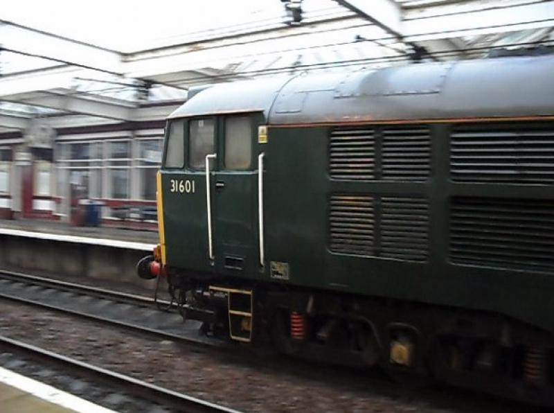1Q18: 31601 passes Troon today on the 30/03/10 coming up on the rear of the serco from Ayr. Photo of 1Q18