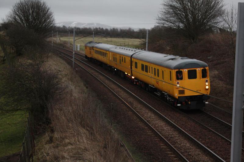 4Q73: 4Q73 Passing silvermuir 19:00 5/4/10 Coach first,in very poor light.31105 at rear. Photo of 4Q73