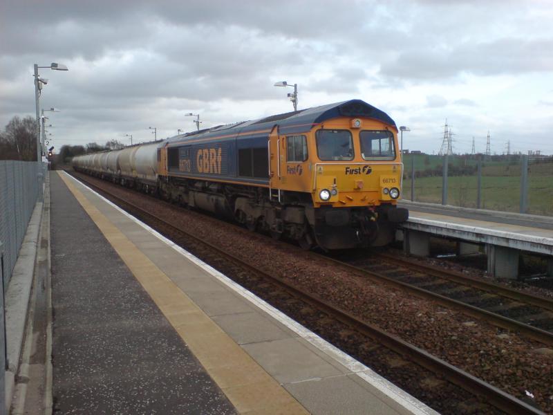 66713 passing through Gartcosh Station: 66713 passing through Gartcosh Station on the 6S44 North Blyth to Ft.William. (08.04.10) Photo of 66713 passing through Gartcosh Station