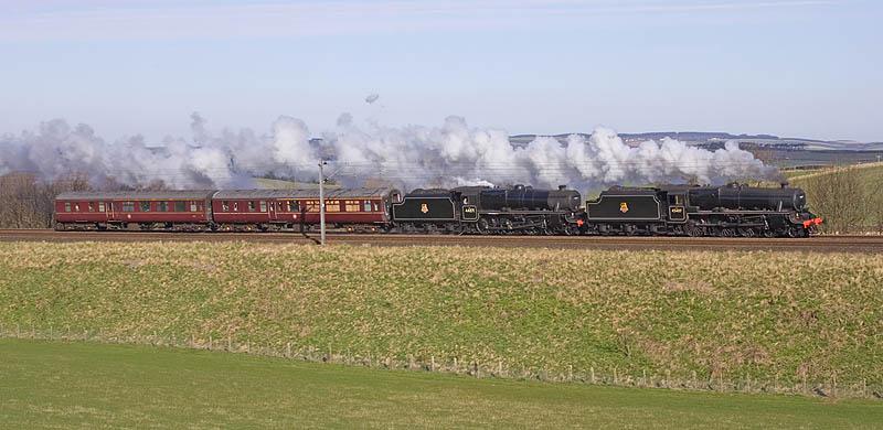 45407 & 44871 at Burnmouth: Amidst glorious weaher conditions and having just crossed Henderson's Bridge, 45407 and 44871 round the corner north of Burnmouth en route to Grosmont from Boness - 12.04.10 Photo of 45407 & 44871 at Burnmouth