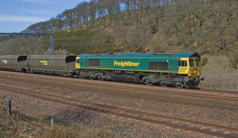 66545 at Mossfield, Grantshouse: Spring appears to have finally arrived as 66545 pulls into the Grantshouse Up Loop on the afternoon of 12th April 2010! Photo of 66545 at Mossfield, Grantshouse