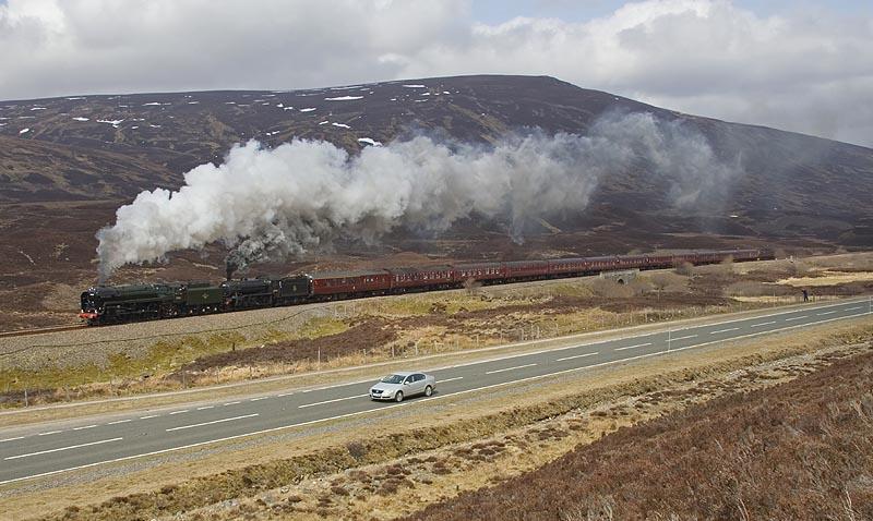 70013 & 61994 on Drumochter: 70013 and 61994 blast onto the Pass of Drumochter having passed Balsporran Cottages on the morning of 13th April 2010. Photo of 70013 & 61994 on Drumochter