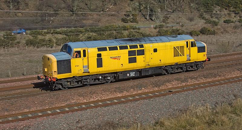 97301: 97301 hurries alongside the A1 near Mossfield, Grantshouse on the afternoon of 12th April 2010. Photo of 97301