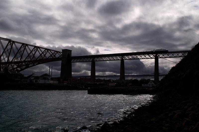 Breaking Skies: 70013 steams off the Forth Bridge with the afternoon SRPS Forth Circle working on 18/04/2010. Photo of Breaking Skies