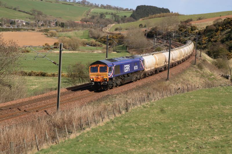66728 at Houndwood: 66728 on 6S44 North Blyth to Fort William at Houndwood on 20/04/2010. Full sun here but clouds within 5 mins & rain at Oxwellmains. Photo of 66728 at Houndwood