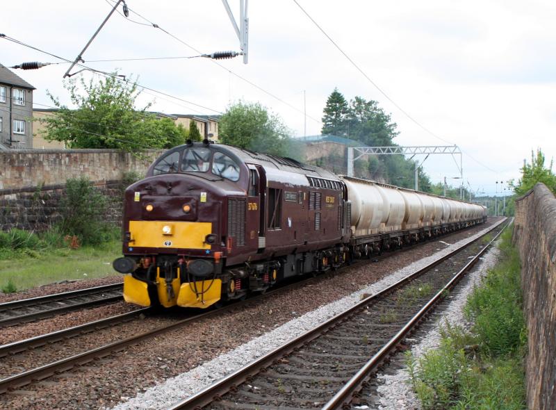 6Y45: 37676 + Alcans + 66729 Passing coatbridge on route to braidhurst loop,the first six wagons then get taken for repair to E.G.Steels yard in Hamilton.Sunday 6/6/10 Photo of 6Y45