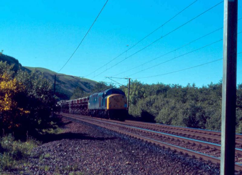 Summit bound: Class 40 at Greskine with a cement train in May 1974.
Derrick Stewart photo. Photo of Summit bound