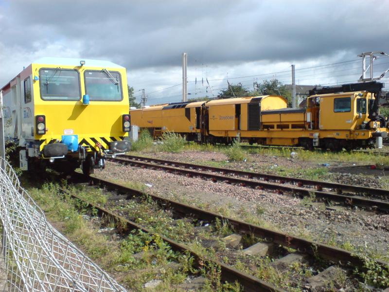 Tamper 73804 & Stoneblower 80215 at Rutherglen OTPD: DR73804 - Plasser & Theurer 08-16U RT Plain Line Tamper & DR80215 - Harsco Track Technologies Stoneblower stabled at Rutherglen OTPD (01.08.10) Photo of Tamper 73804 & Stoneblower 80215 at Rutherglen OTPD