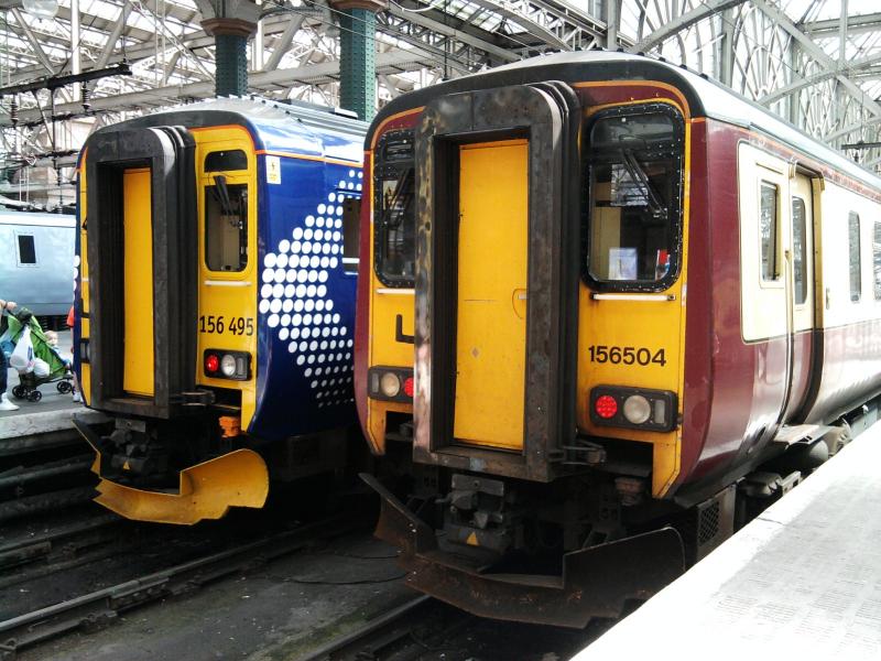 The old and the new liveries: The final 156 in Carmine and Cream, 156 504 stands alongside Saltire-liveried 156 495 at Glasgow Central. Photo of The old and the new liveries