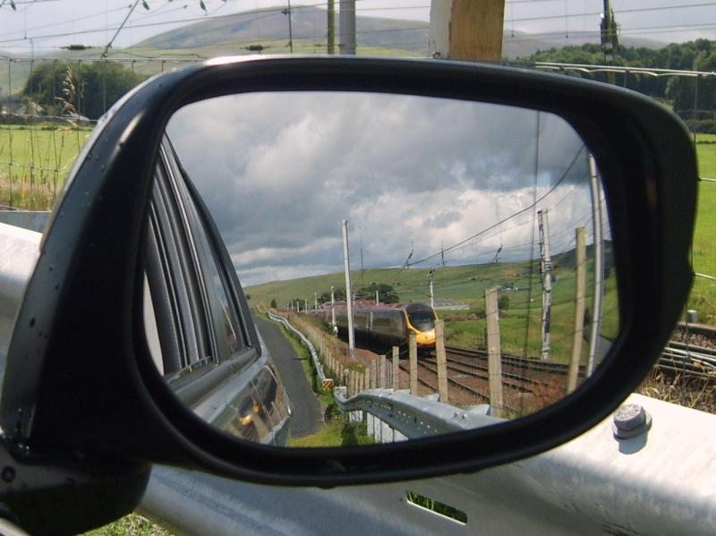 Reflections: Pendolino heads south close to the loops at Abington Photo of Reflections