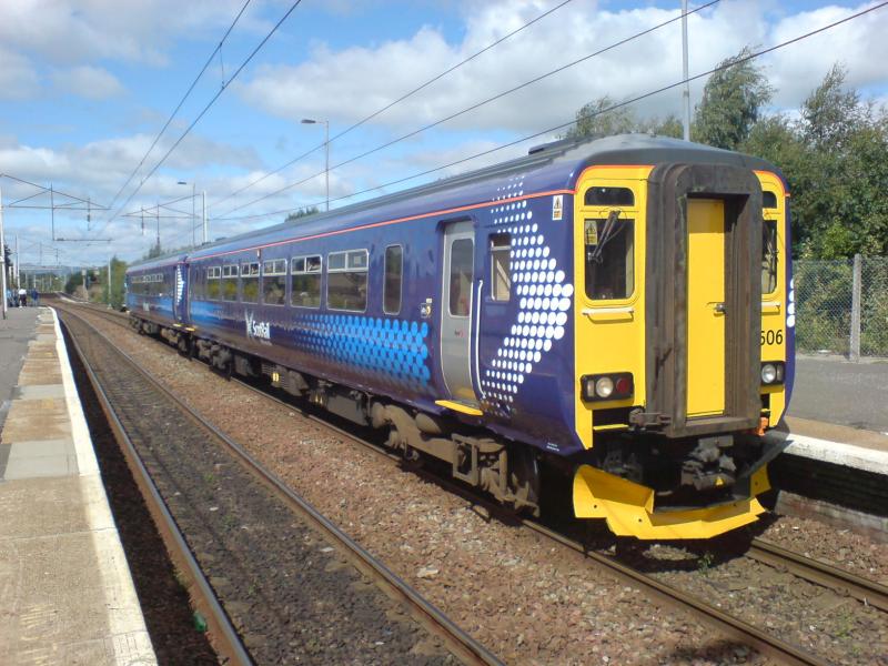 156506 at Coatbridge Central: 156506 calls at Coatbridge Central whilst forming a Cumbernauld - Motherwell service. (17.08.10)
The squad at the end of the platform are waiting on 70001 making an appearance !! Photo of 156506 at Coatbridge Central