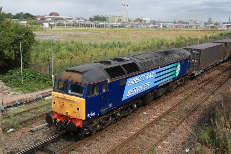 57011 on 4A13: 57011 couples to 4A13 at Fouldubs Jct. This is the best I could get as 66424 shunting the wagons did not go far enough towards Grangemouth before stopping, the sun coming out as well on 20/08/2010. Photo of 57011 on 4A13