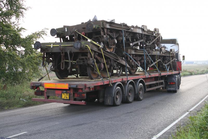 Scrap wagon chassis.: A few of the coal hopper chassis from the wagons being cut up at Thornton Depot on 8th September 2010 head off into the sunset.... Photo of Scrap wagon chassis.
