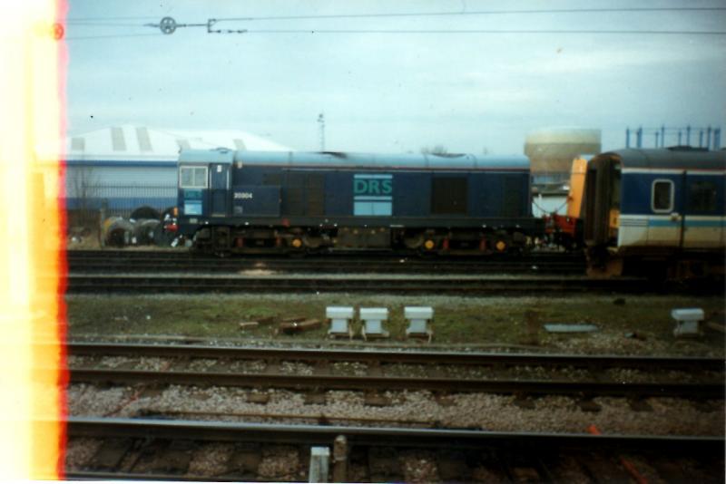 20304 DRS in 1997: Where? I don't know... but i suspect it was in Scotland (note the itsy bitsy winy of 153 on the left..) Photo of 20304 DRS in 1997