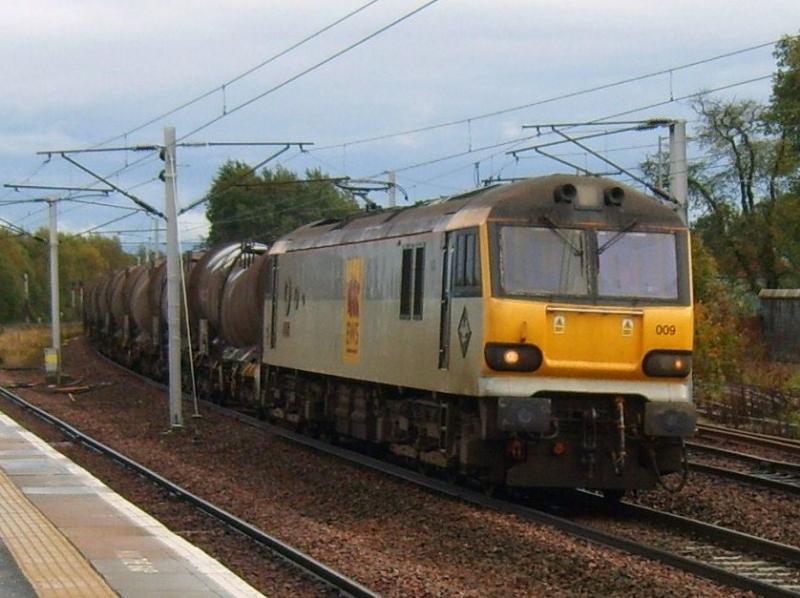 6S94 Dollands Moor to Irvine. 29th September 2010 : 92009 races through Carstairs in a patch of sunshine after a very wet afternoon. Photo of 6S94 Dollands Moor to Irvine. 29th September 2010