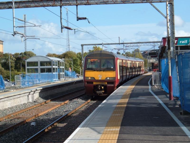 320316 amongst the new: Waiting to depart from the revamped Airdrie on 5th October 2010. Photo of 320316 amongst the new
