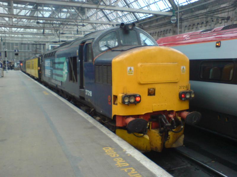 37218 at Glasgow Central: 37218 at Glasgow Central Platform 3 at the head of 1Q18 with Test Coach Mentor and 37069 at the buffers. (12.10.10) Photo of 37218 at Glasgow Central
