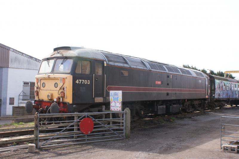 Saint Mungo (hand-painted!): In Fragonset livery , 47703 sits unoperational in the sidings at Leeming Bar on the Wensleydale Railway in N.Yorkshire Photo of Saint Mungo (hand-painted!)