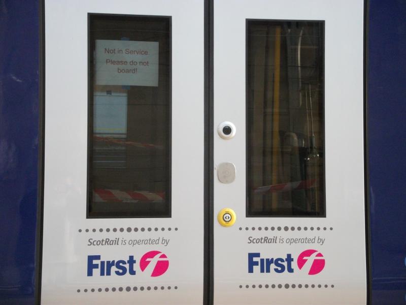 You can't get on!: Notice on doors of 380107, informing passengers they can't get on the trains, which are still not in service. The unit was coupled up to 380105, which didn't have any such notices.
Glasgow Central, 31st October, 2010. Photo of You can't get on!
