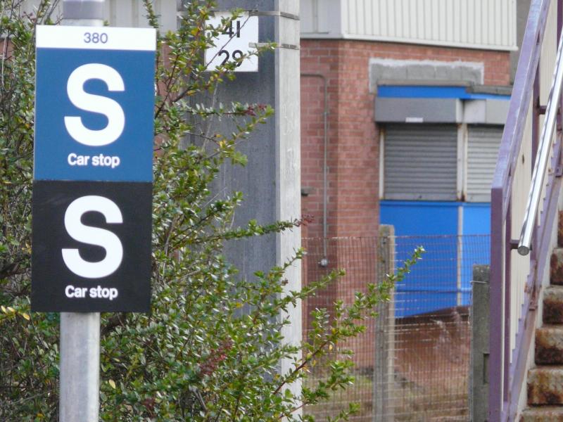 Multi-coloured car stop signs at Barassie: Class 380 S Car stop signs at Barassie Station in blue and black. Photo of Multi-coloured car stop signs at Barassie