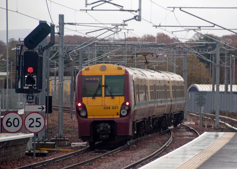 334021 on Bathgate crossover 4/11/10: 334021 crosses onto Down line to go back to Airdrie for another driver training run, Photo taken at 1237 on 4/11/10 Photo of 334021 on Bathgate crossover 4/11/10