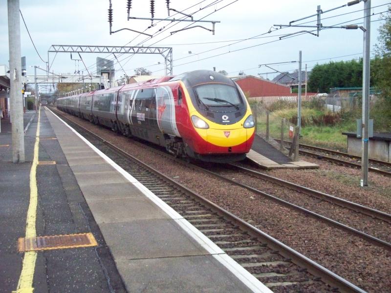 390004 new livery: New Alstom Liveried 390004 rattles through Lockerbie bound for London Euston Photo of 390004 new livery