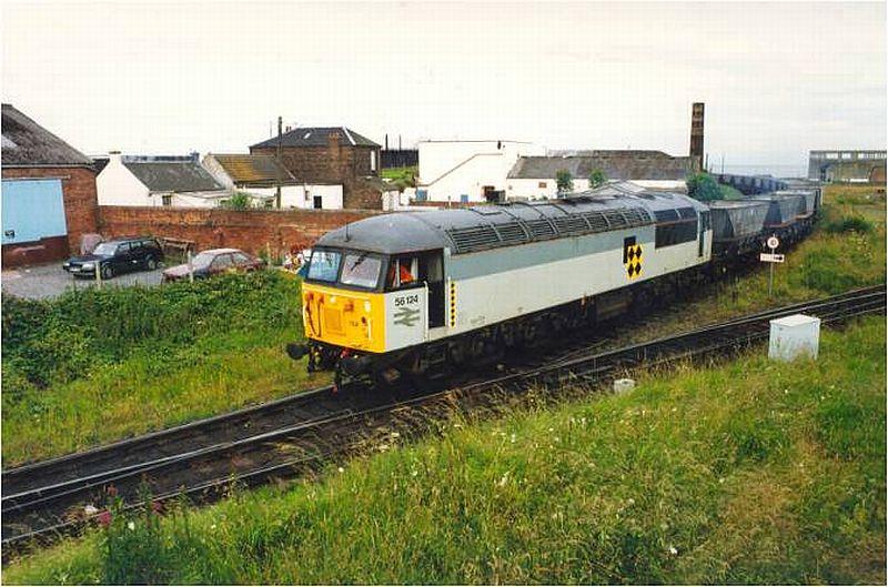 56.124: 56.124 coming off the Ayr Harbour branch at Newton-on-Ayr junction with coal empties on 22nd July 1993. Transrail livery. Photo of 56.124