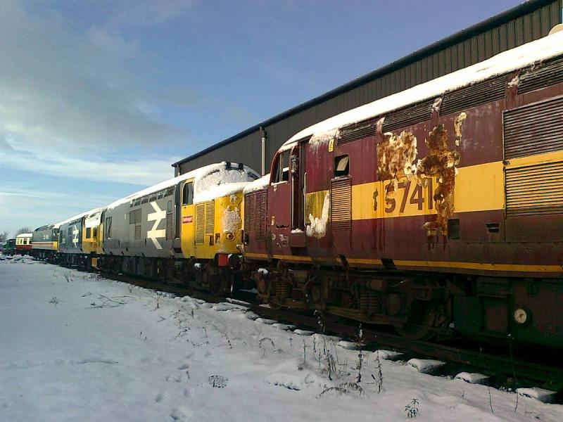 Awaiting duties: The preserved line-up of (R-L) 37413, 37906, 37025 & 47643 stand silent in the recent layer of snow at Bo'ness. 29th November 2010 Photo of Awaiting duties