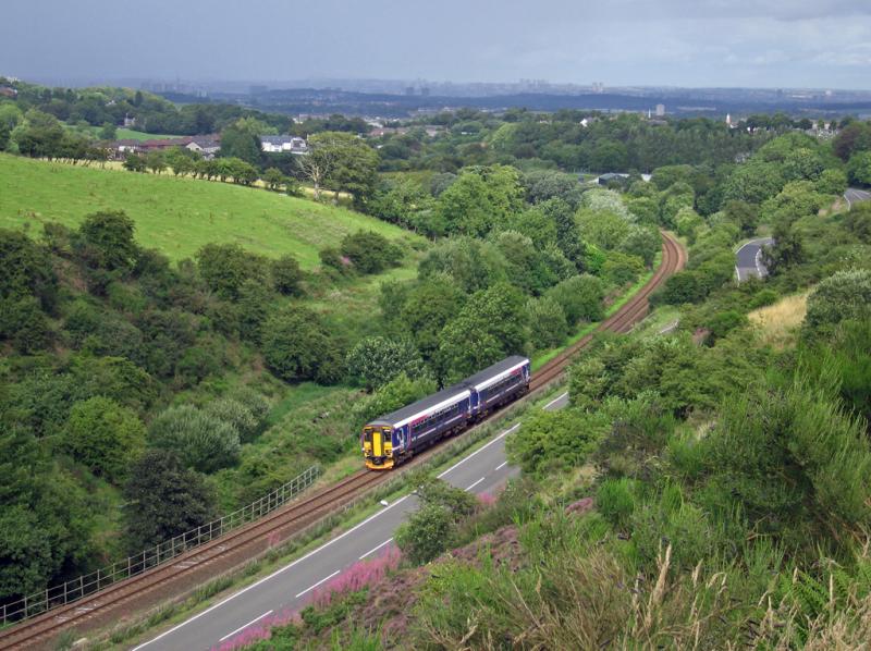 On the Glasgow & Kilmarnock Joint line: The 15:48 Glasgow-Newcastle approaches the site of Neilston (Low) station. August 9, 2006. Photo of On the Glasgow & Kilmarnock Joint line